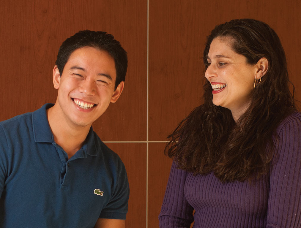 Student Chinsin Sim and Stephanie Fallas talking to each other